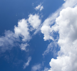 Naklejka na ściany i meble White clouds in a dark blue sky in Europe