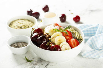 Breakfast bowl with fruits, seeds and berries
