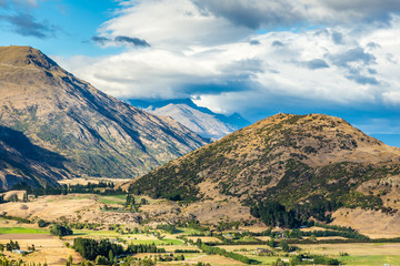View from Crown Range Lookout, South Island, New Zealand, showing mountains overlooking a valley.