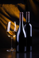 Wine bottles and a glass