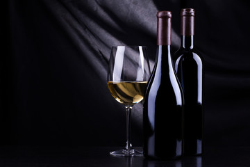 Wine bottles and a glass