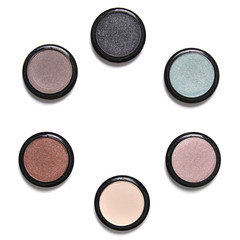 Individual eyeshadow make up pots arranged in a circle and isolated on a white background - obrazy, fototapety, plakaty