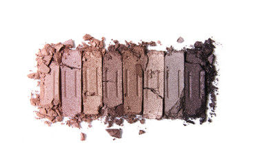 A smashed, neutral toned eyeshadow make up palette isolated on a white background