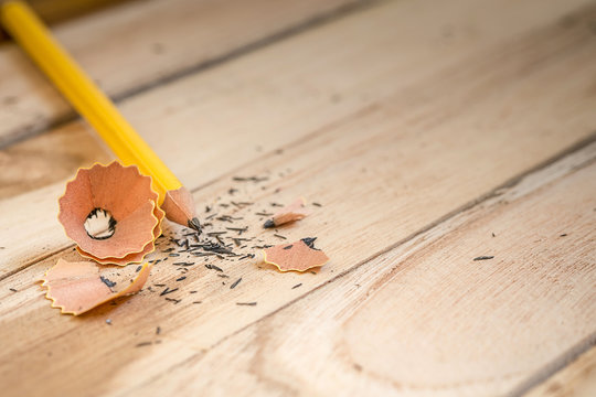 Pencil and sharpening shavings on wood table