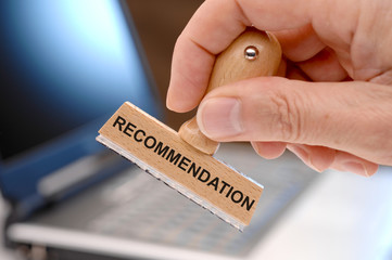 recommendation printed on rubber stamp in hand - obrazy, fototapety, plakaty