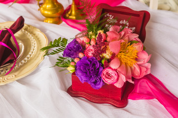 box for rings decorated flowers on the table