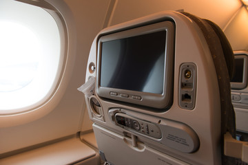 Plane seat with TV screen