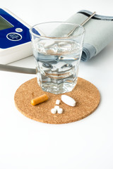 Blood pressure monitor and pills