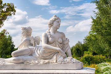 marble statue of greek goddess and cupid