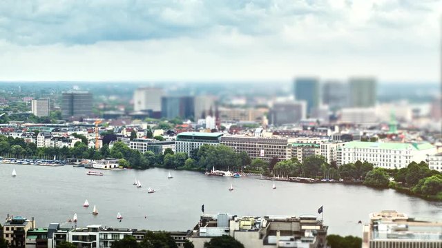 Yachts float down Alster river Hamburg Germany sunny blur timelapse