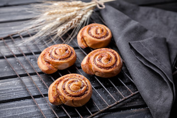 Delicious pastry on dark wooden background