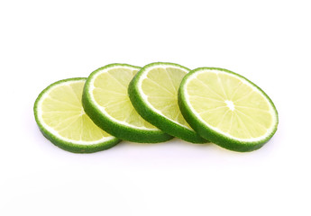 Green lemon slice isolated on white background