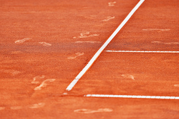 Footprints on tennis clay court