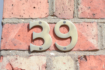 House number 39 sign on wall