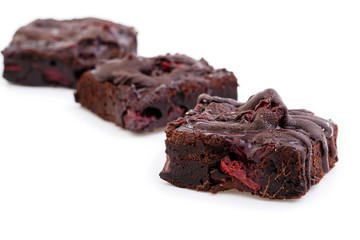 Delicious vegetarian brownie with cherries isolated on white bac