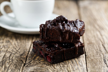 Tasty vegetarian brownie slice on wooden table for celebration.