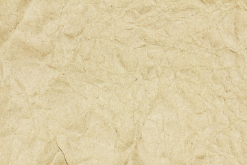 Naklejka premium Recycled crumpled brown paper texture or paper background for design with copy space for text or image.