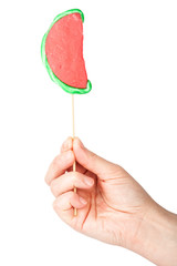 Hand holding lollipop