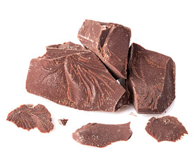 Chocolate pieces close-up isolated on a white background.