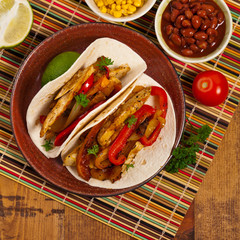 Fajita Chicken Tacos with Grilled Onions and Bell Peppers. Selective focus.