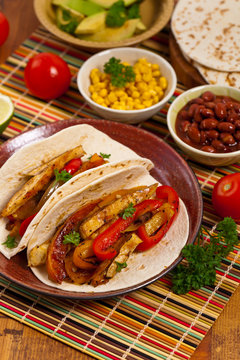 Fajita Chicken Tacos with Grilled Onions and Bell Peppers. Selective focus.