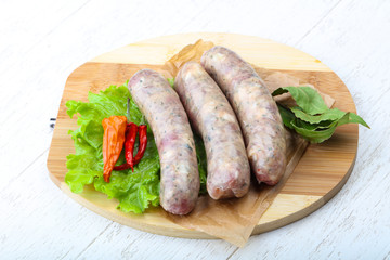 Raw sausages for cooking