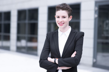 Modern business woman crossing hands