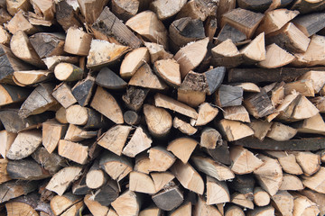 Stacked dried log background texture