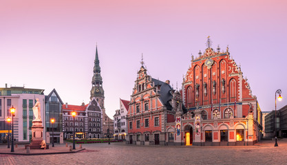 City Hall Square with House of the Blackheads and Saint Peter church in Riga Old Town During sunset time. - obrazy, fototapety, plakaty