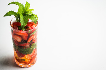 Strawberry mojito cocktail on the wooden background