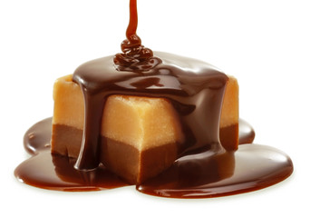 Chocolate flow on Fudge. Isolated on a white.