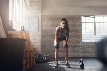 Woman looking focused about her fitness workout