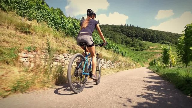 Young woman riding her mountain bike