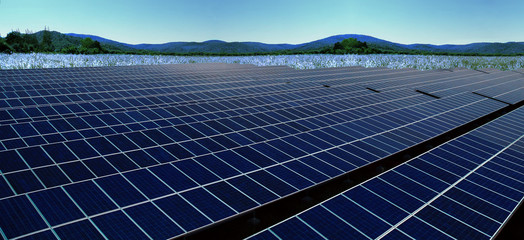 Solar farm,solar power panel on meadow flowers hills landscape
