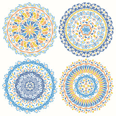 Collection of bright colorful geometric round ethnic decorative elements. Vector mandala backgrounds with bohemian, African, Oriental, Indian, Arabic motifs.