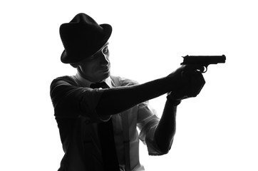 Silhouette of detective with two guns