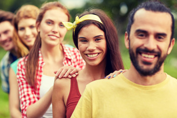 group of smiling friends outdoors