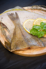 raw sole round cutting board lemon basil