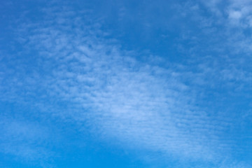 Fototapeta na wymiar White clouds on a blue sky. Selective focus