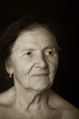 Portrait of elderly woman. Attentiveness. Toned