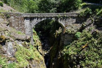 Old roman bridge of Cane on Malvaglia valley