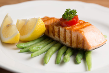 Grill Salmon steak with lemon and vegetable prepare to serve