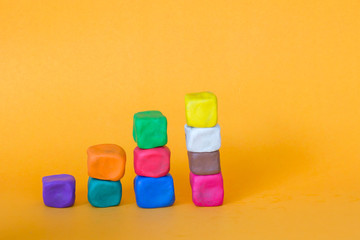 blocks of colorful modeling clay, stack of cube