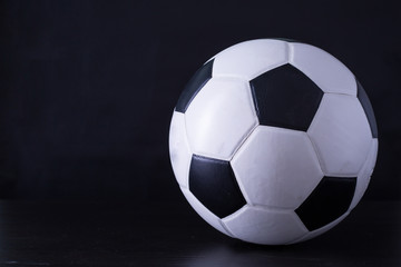 Fototapeta premium Soccer ball close up with black background