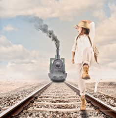 little explorer running in front of an steam locomotive