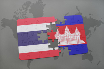 puzzle with the national flag of thailand and cambodia on a world map background.