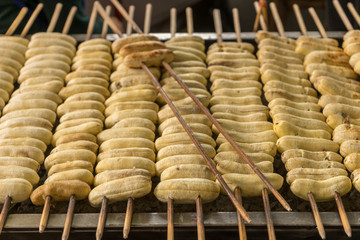 Grilled banana skewers on the oven, street food in Bangkok, Thailand