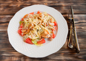 Tasty shrimps and grapefruit salad decorated with cheese