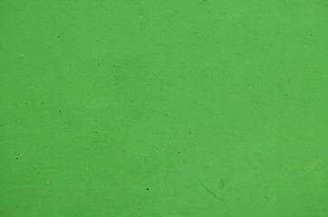 Surface of concrete wall painted in green color