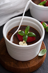 Chocolate pudding with raspberries and basil